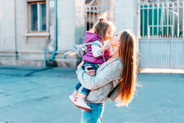 istock Mother holds a small daughter in her arms 825223370