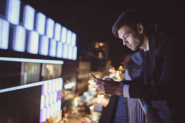 istock Young Businessman on the roof texting 825223450