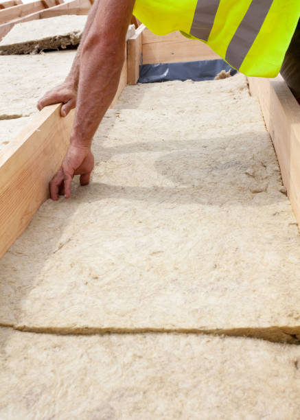 istock Roofer builder worker installing roof insulation material on new house under construction 825224102