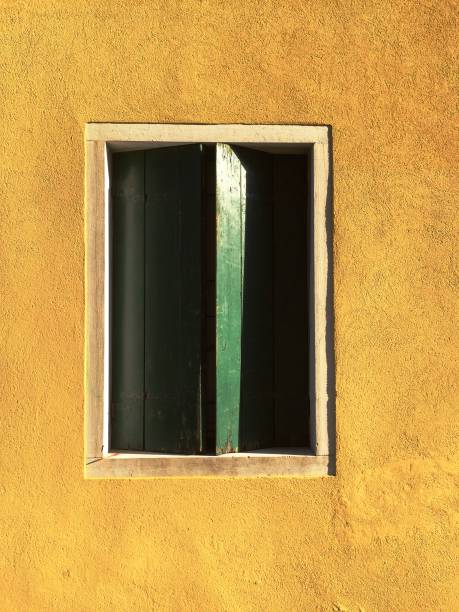 istock Architecture in Venice - Green Window in a yellow wall (Venice, Italy) 825226454