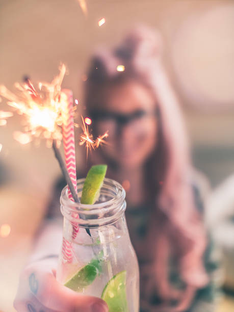 istock Tattooed Woman with Sparkling Cocktail 825228096