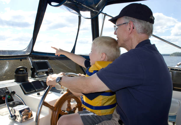 istock grandfather and grandson look for adventure 825231264