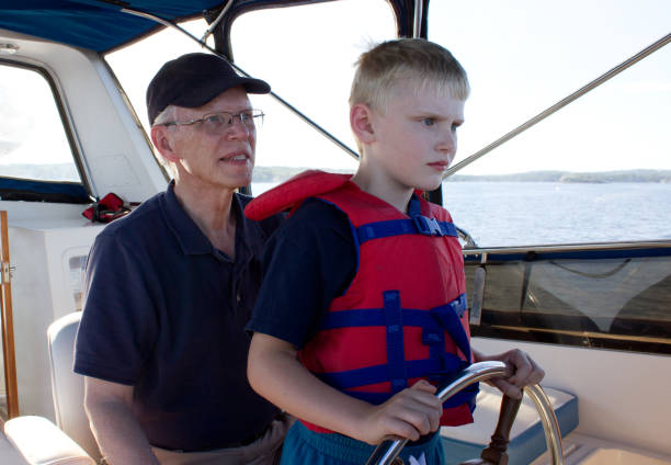 istock a serious child learns from his grandfather 825231266