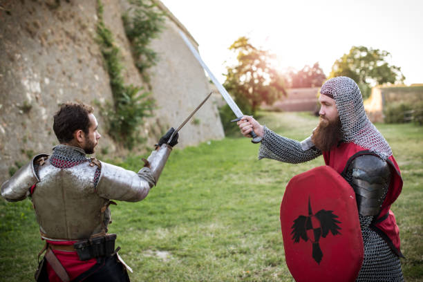 istock Courageous knights exercising sword tactics 825234374
