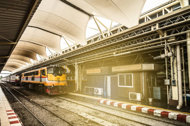 istock Classicistical train station and train at the railway station at sunlight. 825234880