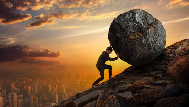 istock Business man pushing large stone up to hill , Business heavy tasks and problems concept. 825235734