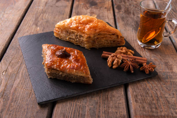 istock Turkish sweets baklava with tea nuts and cinnamon 825236036