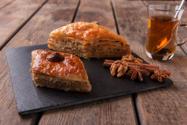 istock Turkish sweets baklava with tea nuts and cinnamon 825236044
