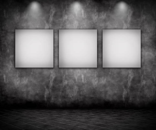 istock 3D grunge interior with blank pictures under spotlights 825243150