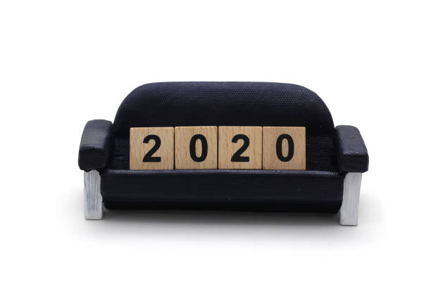 istock isolated 2020 dice on the miniature sofa on white background 825244296