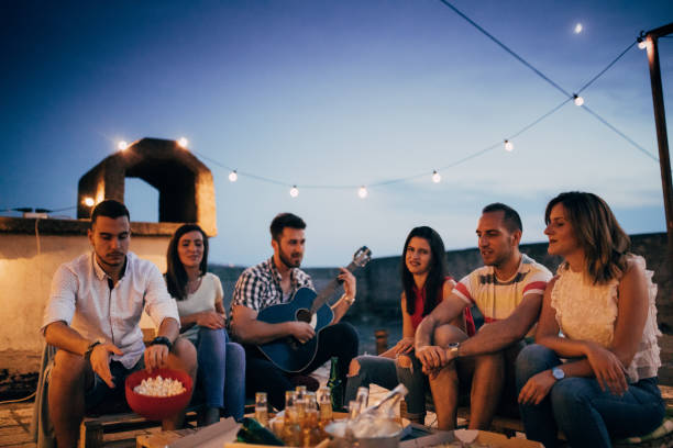 istock Friends at rooftop party 825250450
