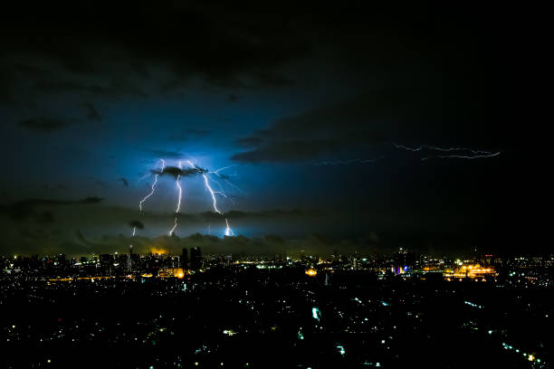 istock Dramatic thunder storm lightning bolt on the horizontal sky and city scape 825254984