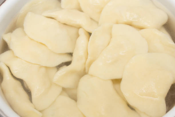 istock Vareniki with potatoes are cooked in a saucepan 825255326