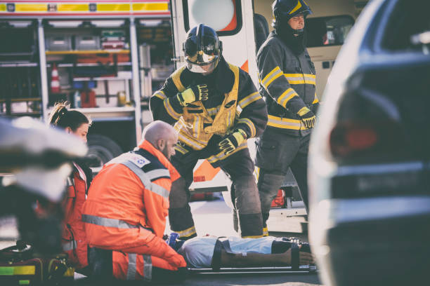 istock Firefighters and paramedics on accident scene 825259032