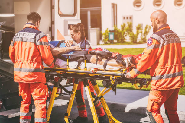 istock Paramedic team helping injured person 825260322