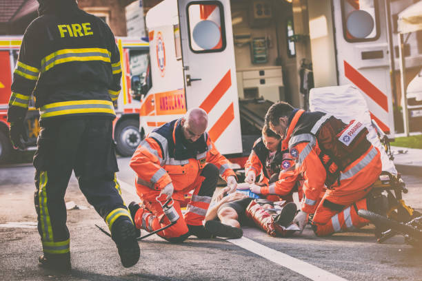 istock Paramedics helping injured cyclist 825260440