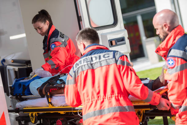 istock Paramedic team helping injured person 825261320