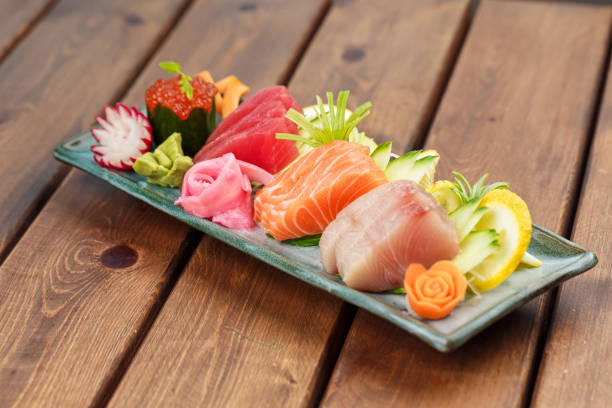 Raw Seafood selections fresh seafood selection on the plate with wasabi and ginger васаби stock pictures, royalty-free photos & images