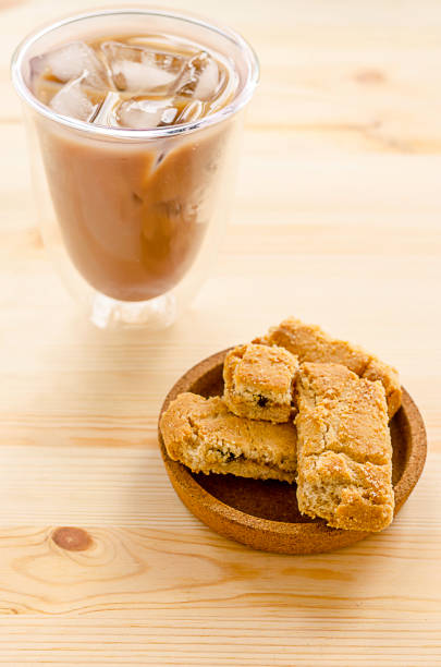 istock Apple strudel crispy pies and ice coffee on wood background. 825267728