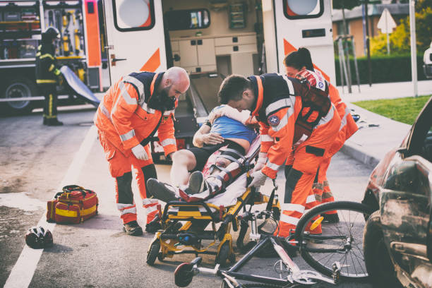 istock Paramedics helping injured cyclist 825268198
