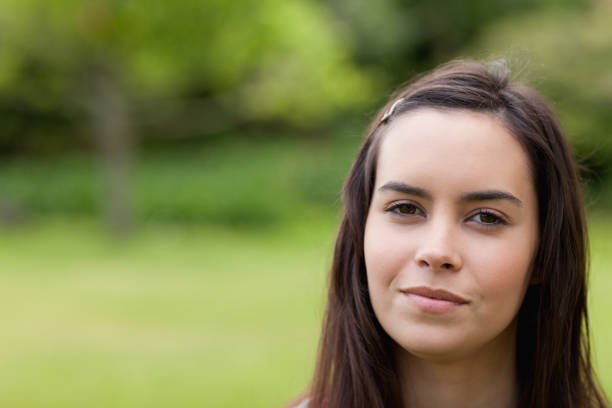 istock Young calm woman outdoors in a park 825274986