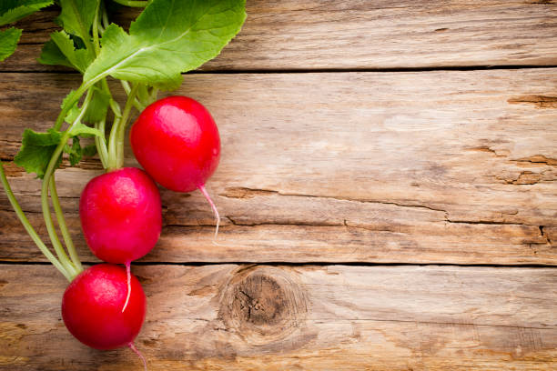 istock Radish on the wooden table. 825275130