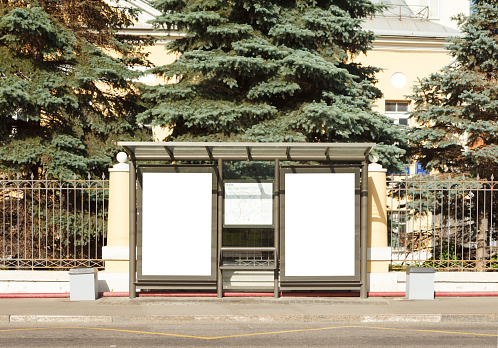 Two blank billboards mockup in bus stop.