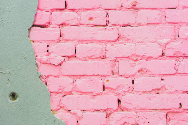 istock Beautiful abstract background from concrete and Painted pink brick wall texture urban background, space for text. Exposed brick on damaged wall 825321198