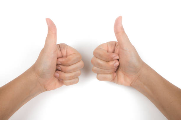 istock woman gesturing thumbs up 825323514
