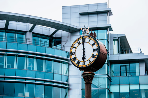 A classic clock at a modern financial district