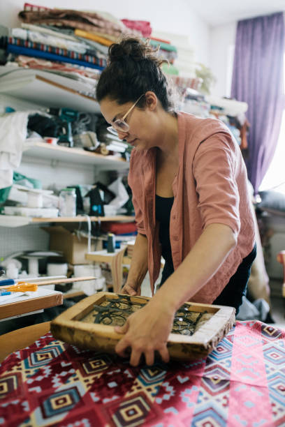 istock Craftswoman Reupholstering A Chair 825335856