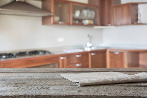 istock Blurred background. Modern kitchen with tabletop and space for you. 825336120