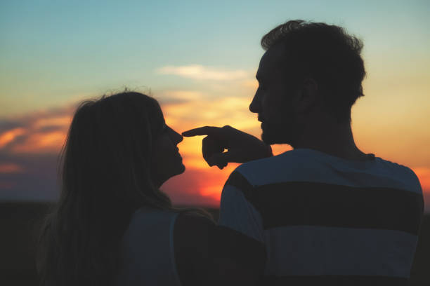 istock Young couple enjoying outdoors in the field. 825336820