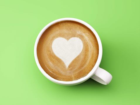 Heart Shape Coffee Cup Concept isolated on green background