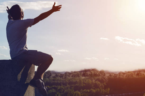 istock free man tranquil at sunset scene 825344710