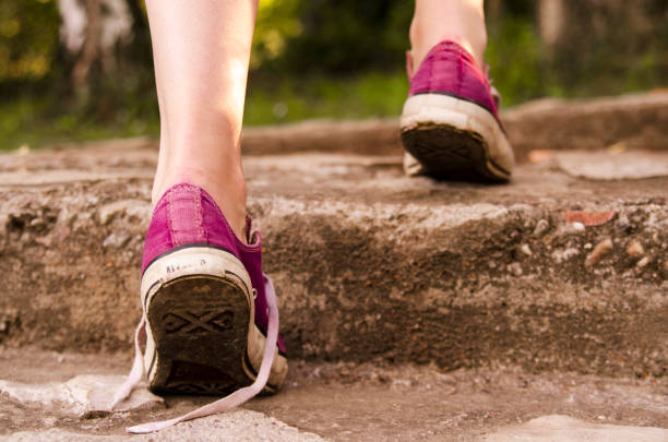 istock Footstep in sport sneakers. Active in youth. Persistent attitude. Step by step successful concept 825348234