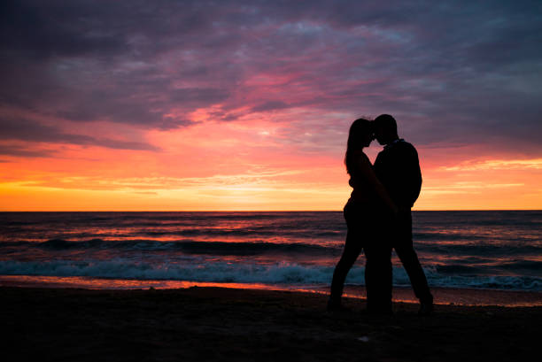 Lovers at sunset, beautiful sea scenery