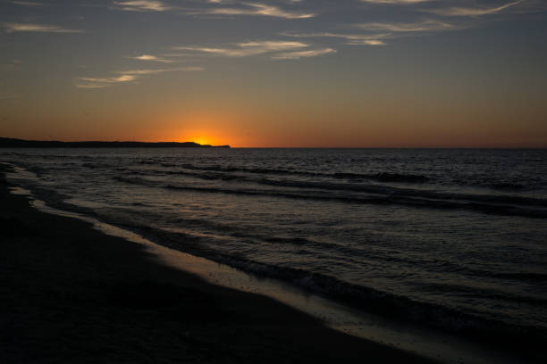 istock sunset by the sea 825359282