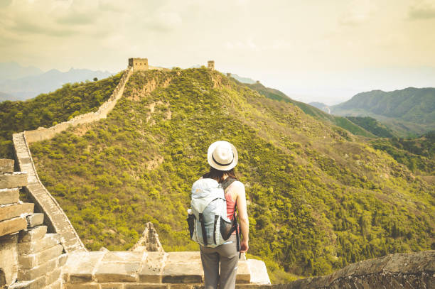 istock Female standing on great wall by Jinshaling 825359800