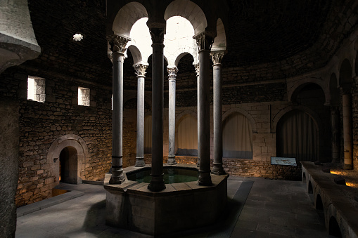 GIRONA, SPAIN - 29 JUNE 2017 - Main hall from the inside of the so-called Arab baths of Girona constitute a Christian building of Romanesque style in Girona, Catalonia, Spain
