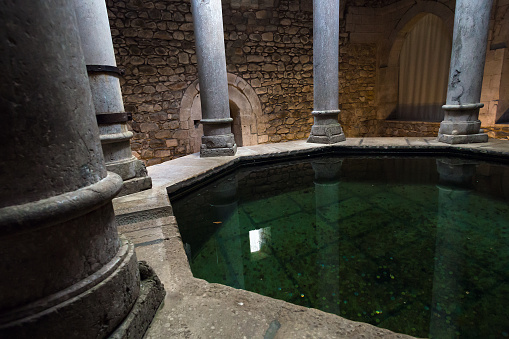 GIRONA, SPAIN - 29 JUNE 2017 - Main hall from the inside of the so-called Arab baths of Girona constitute a Christian building of Romanesque style in Girona, Catalonia, Spain