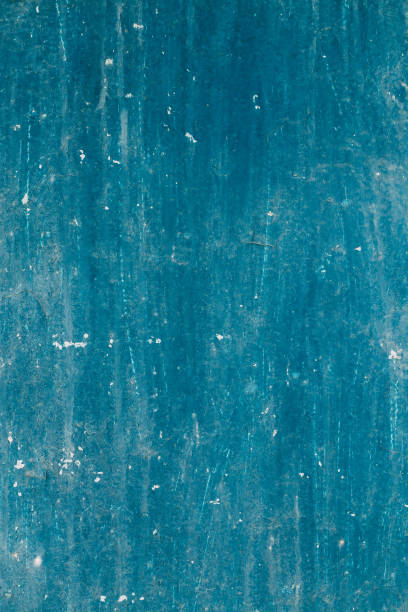 istock Abstract Colored Blue Texture With Cracks And Unevenness Of Paint 825371838