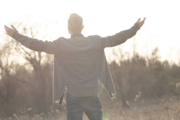 istock Young man with arms outstretched 825375114
