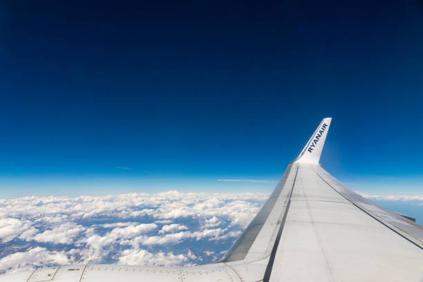 FRANCE - JUNE 12, 2017: Boeing 737-8AS (reg. number EI-DCK), operated by RyanAir, flights over European Alps. View through the window