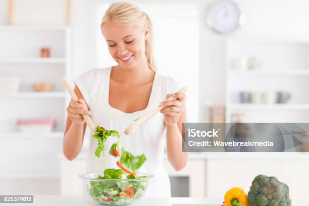 Gorgeous Woman Mixing A Salad Stock Photo - Download Image Now - 20-24 Years, 20-29 Years, Adult