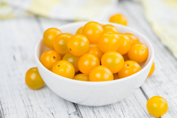 istock Portion of Yellow Tomatoes , selective focus 825382526