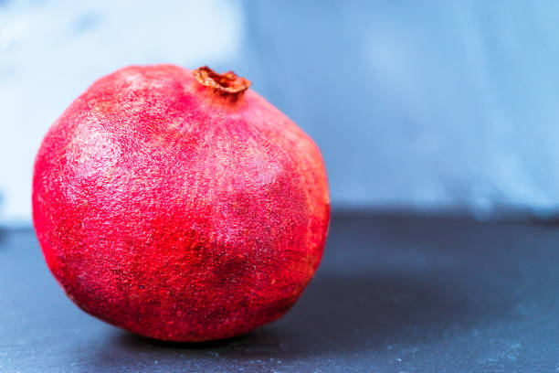 fresh juicy pomegranate on dark vintage background  with copy space - usa restaurant flower bed beauty in nature imagens e fotografias de stock