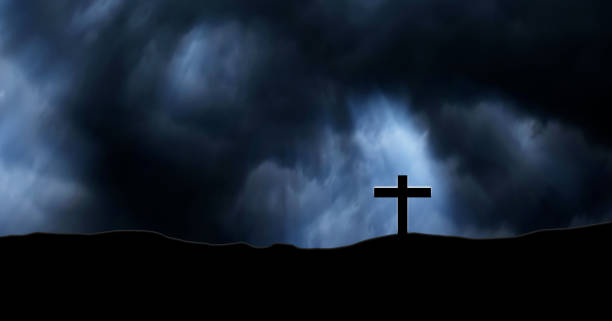 istock Rain clouds on Christian crosses graves. 825397274