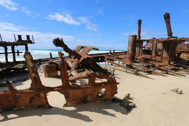 Sunny day and a shipwreck on the beach at Fraser Island in Queensland Australia.