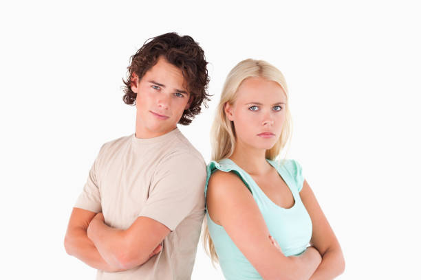 istock Unhappy serious couple looking into the camera 825401954